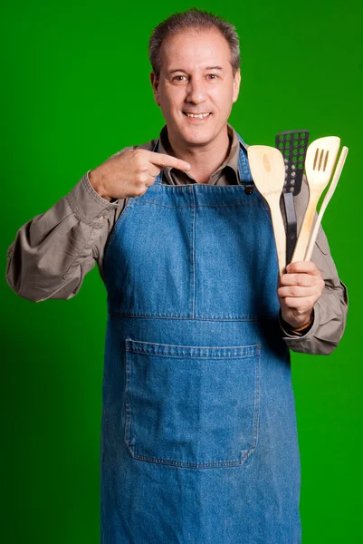 Kuchař ukazující jeho nástroje — Stock fotografie