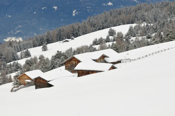 Mountain huts in a snowy landscape — Stock Photo, Image