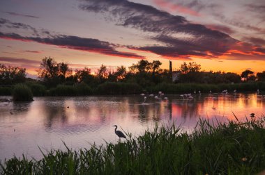 HDR image of lagoon at sunset clipart