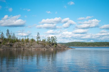 Northern Forest Islands In A Huge Lake clipart