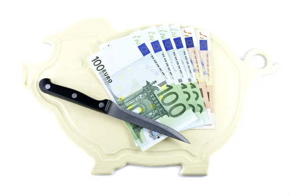 Kitchen board, kitchen knife and money — Stock Photo, Image