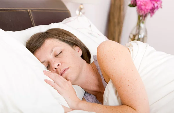 Brunette Asleep in her Bed — Stock Photo, Image