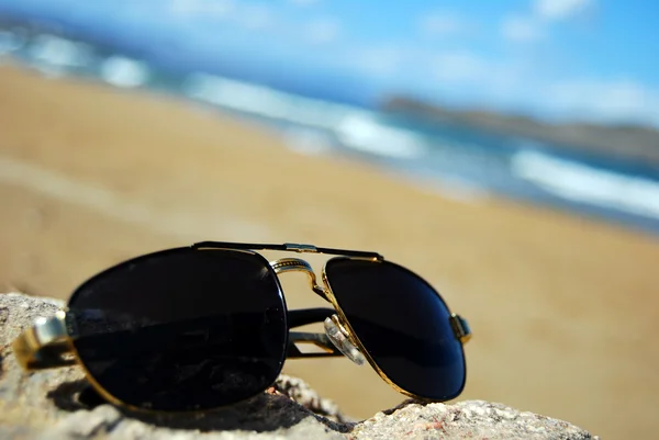 Cool shades on beach — Stock Photo, Image