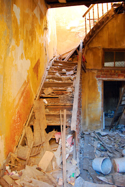 An old derelict building interior, abandoned and falling to pieces.
