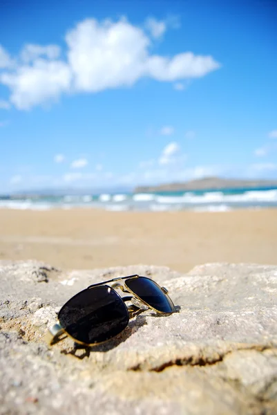 Trendy sunglasses on beach — Stock Photo, Image