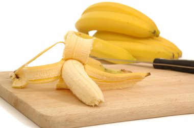 Bananas on a carving board clipart