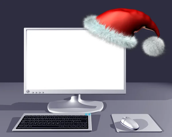 Desktop computer with Christmas hat — Stock Photo, Image