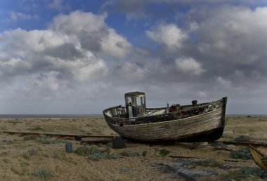 Old fishing boat on the beach clipart