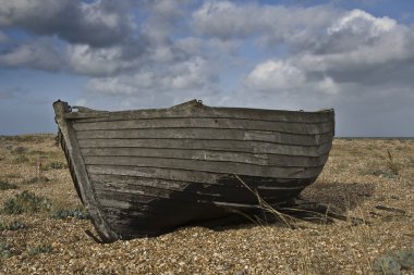 Old fishing boat on the beach clipart