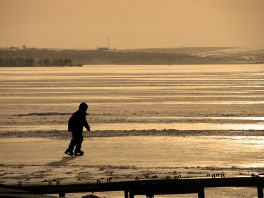 Skating on a river clipart