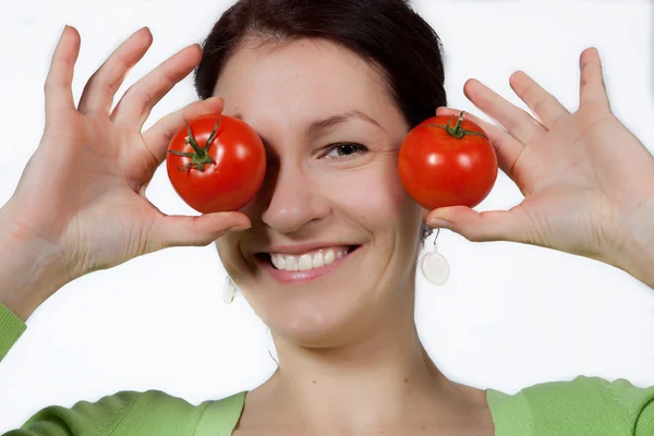 Woman with tomatoes — Stock Photo, Image