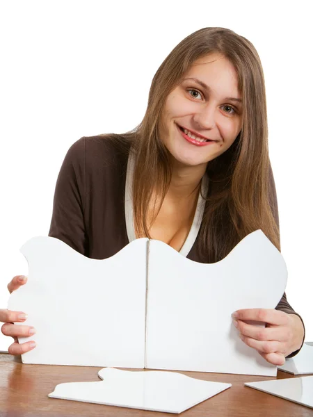Woman exposing puzzle cards — Stock Photo, Image