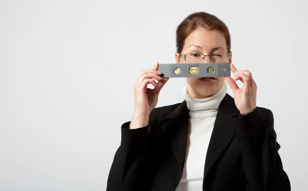 Business woman with pocket level — Stock Photo, Image