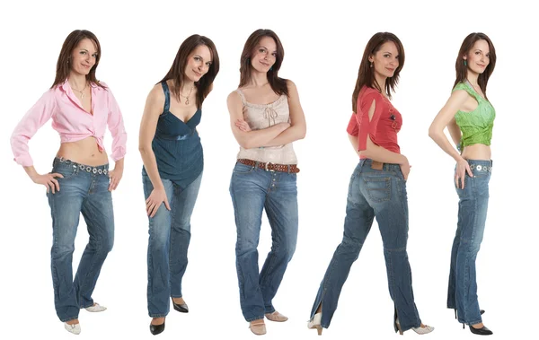 ジーンズの 5 若い女は、さまざまなトップス — ストック写真