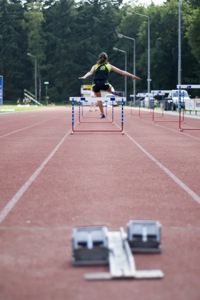 Taking hurdles — Stock Photo, Image
