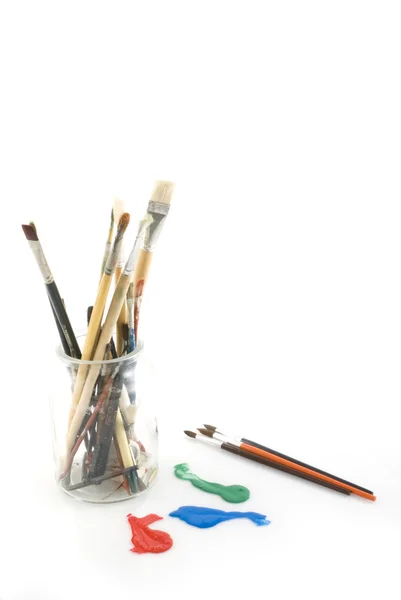 Vidro com lápis e pincéis velhos — Fotografia de Stock