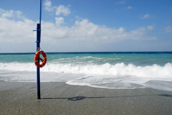 Life buoy at the beach — Stock Photo, Image