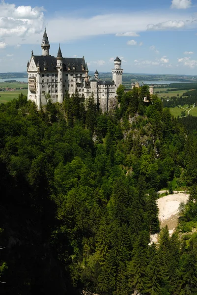 Castle Neuschwanstein in landscape — Stock Photo, Image