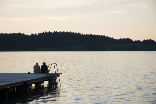 Elderly couple by sunset