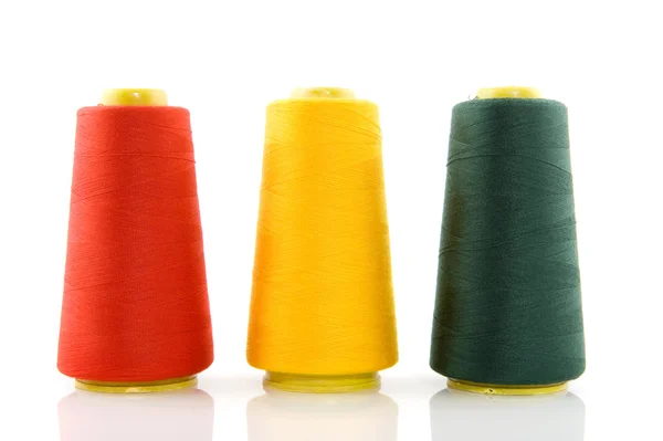 Three bobbins with threads — Stock Photo, Image