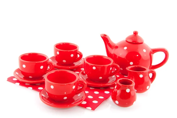 Červený tečkovaný nádobí — Stock fotografie
