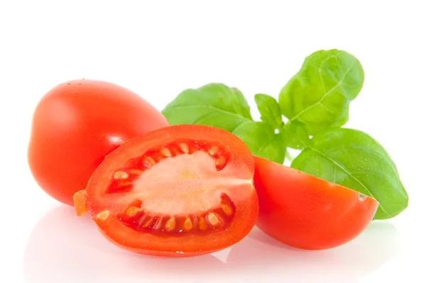 Tomatoes with basil — Stock Photo, Image
