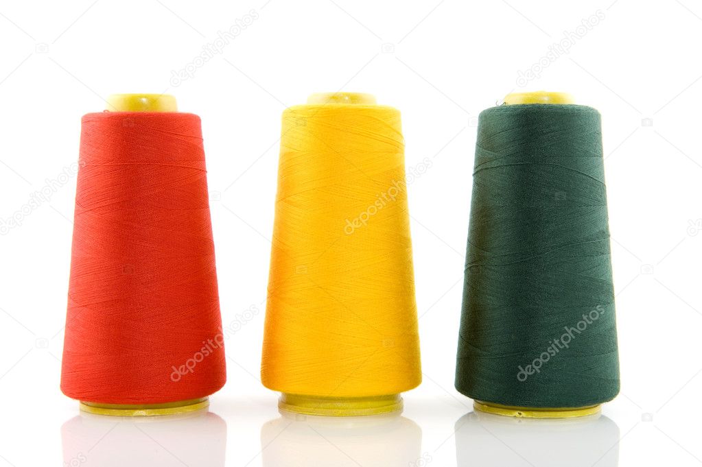 Three bobbins with threads