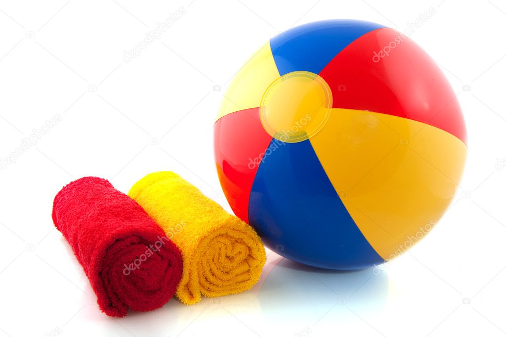 Beachball and rolled towels