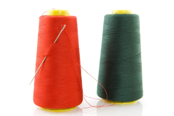 Two bobbins with threads — Stock Photo, Image