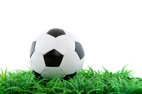 Soccer ball in green grass — Stock Photo, Image