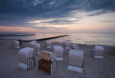 Beach chairs in the evening clipart