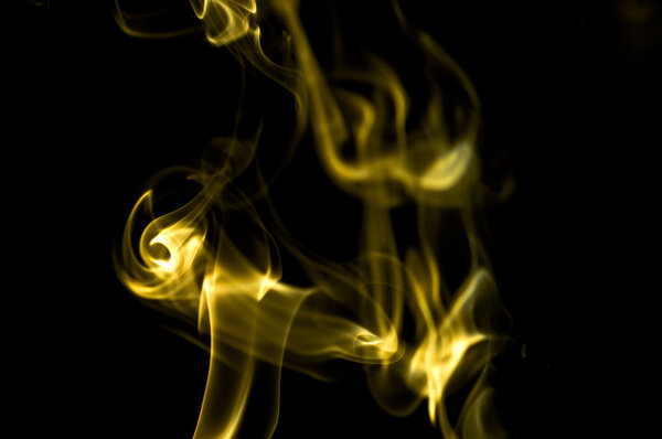 Puff of aroma smoke on a dark background
