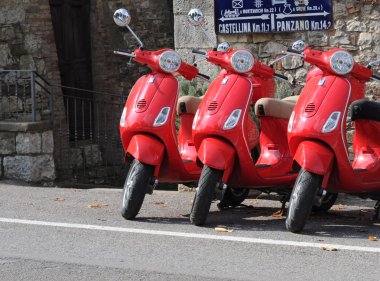 Three red scooters in Tuscany clipart