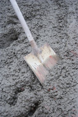 Shovel in Wet Concrete clipart