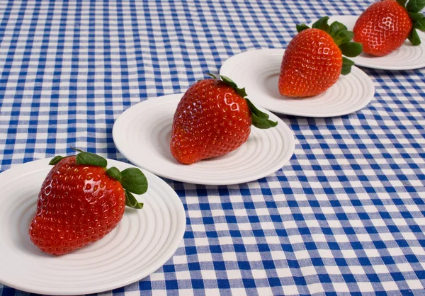 Strawberries on blue gingham — Stock Photo, Image