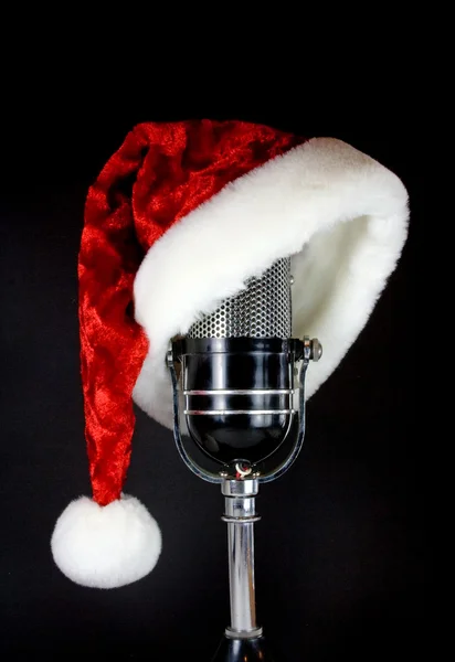 Chapéu de Santa no microfone Fotografia De Stock