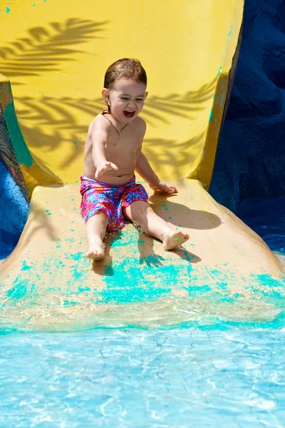 stock image The little girl plays in water