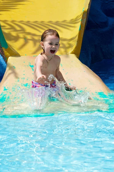 stock image The littel girl plays in water