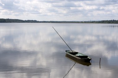 Fisherman boat at the Rozmberk pond clipart