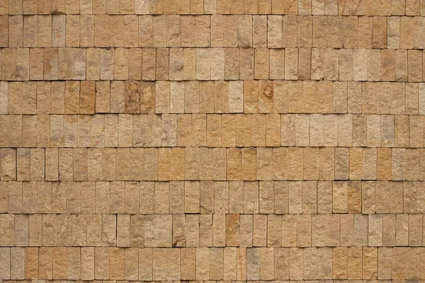 Wand aus ockerfarbenen Ziegeln — Stockfoto