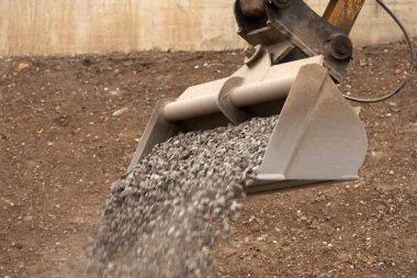 Dipper working with gravel clipart