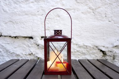 Lantern on a table clipart