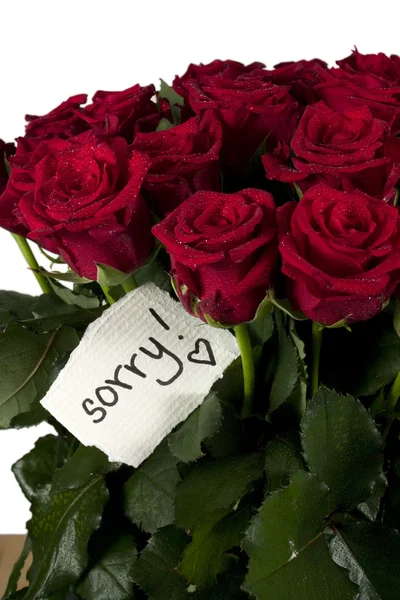Un bouquet de roses avec une note — Photo