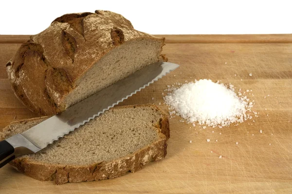 Sliced bread, salt, and knife — Stock Photo, Image
