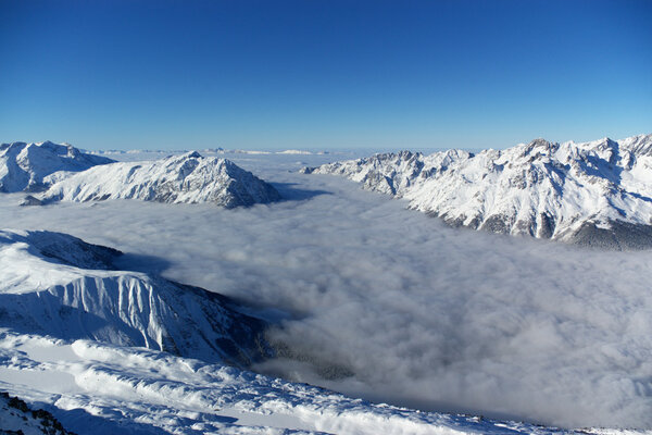 Panoramic view on Alps winter mountains