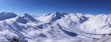 Panoramic view on Alps winter mountains clipart