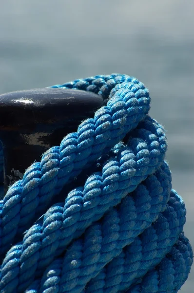 stock image Bollard and blue rope