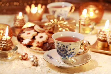 Hot tea with sweet cookies clipart
