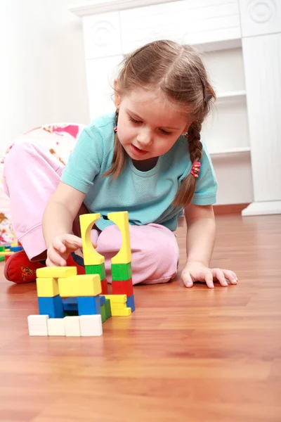 Adorable girl playing with blocks — Stock Photo, Image