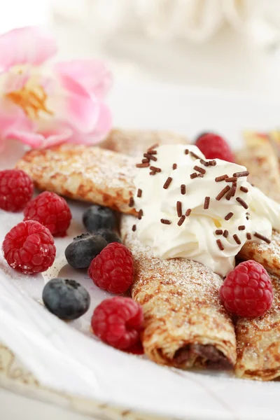Crepes filled with chocolate and fruits — Stock Photo, Image
